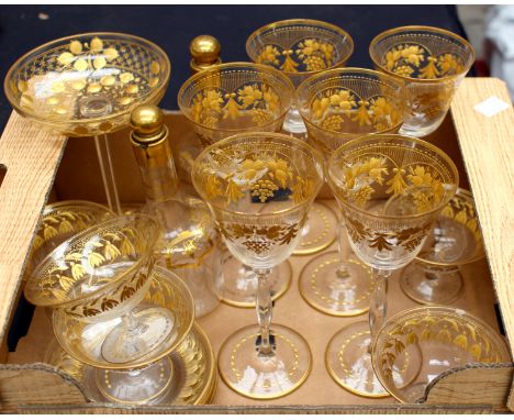 A suite of Bohemian clear cut and gilt glasswares, late 19th century, including oval tray, coupes, saucers, pair of spirit bo