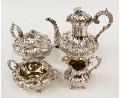 A William IV silver four piece tea service, comprising coffee pot, tea pot, sugar basin and milk jug, each of melon form with