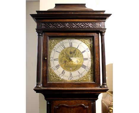 A George III oak eight day longcase clock, circa 1770, the dial inscribed 'J Young, Nantwich' the hood with a caddy top, over