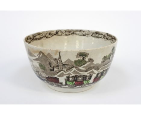 A 19th century pearlware, transfer decorated train bowl, depicting a steam engine and carriagesin a landscape, 17cm diameter,