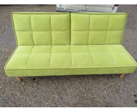 A retro style green sofa bed