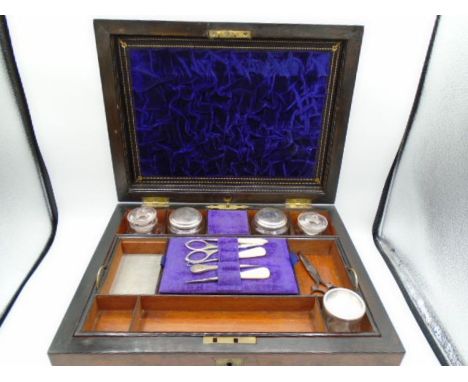 A Burr walnut veneered ladies travel vanity trinket case, with contents - to include cut glass bottles, a vintage feather pow