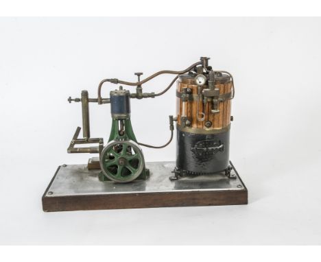 A Model Vertical Boiler and Steam Engine by Stuart Turner or Similar, the boiler standing approx 9" high and 4" diameter, mou