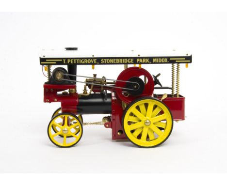 A Wilesco Live Steam Tablet-fired D409 Showman's Traction Engine, in red/black/yellow 'T Pettigrove' livery, with generator a
