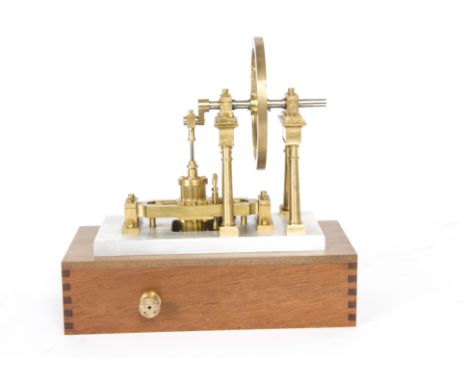 A Rocking-Cylinder Vertical Steam Engine, possibly from a kit, with pillar-mounted crankshaft, approx 3¾" brass flywheel, flu