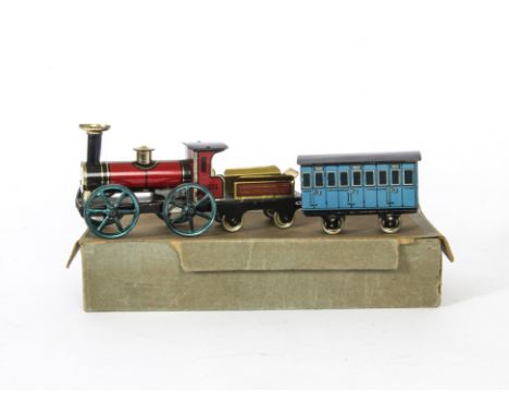 Large Hess 'Penny Toy ' Train and Coach, red and black clockwork engine No 575 with four-spoke wheels and two sets of smaller