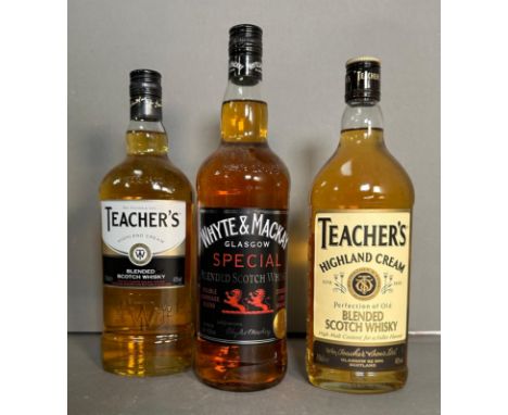 Three bottles of blended Scotch whiskey, two Teachers and a Whyte and Mackary 