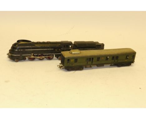A Märklin HO Gauge 3-rail SK800 Streamlined 4-6-4 Locomotive mit Tender und 354 Gepackwagen, the loco in silver-lined black, 