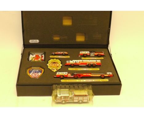 Code 3 Collectibles Fire Service Vehicles,, Cased F.D.N.Y. battalion 44 gift set comprising four vehicles and two cloth badge