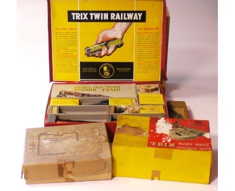 A Trix Twin Railway OO Gauge 3-rail AC Set, ref 1/334 with BR dark blue locomotive 46256, tender and three red/cream coaches,