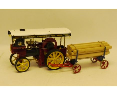 A Wilesco Live Steam Showman's Engine and Timber Trailer, both in red livery, engine appears totally unused, both in original