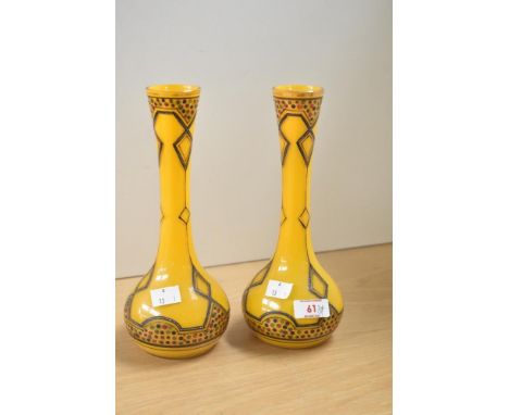 A pair of continental coloured glass baluster vases in the Art Nouveau style, decorated having hand painted polychromatic pat