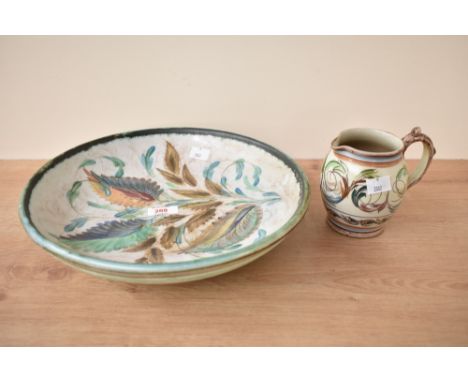A Glyn Colledge Denby footed pottery vase, hand coloured with stylised floral patterns, w31cm, sold together with a similar j