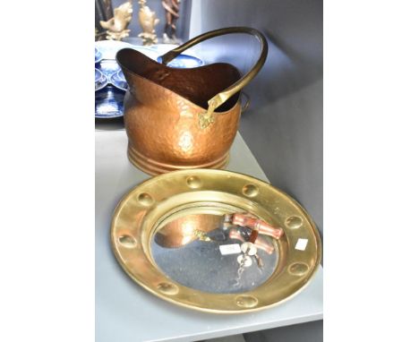 A brass convex porthole style mirror, w36cm, sold together with two corkscrews and a copper scuttle, (4)