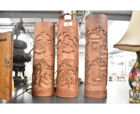 A Chinese bamboo table lamp hand carved with typical landscape scenes, h36.5cm, sold together with two similar lamps, ( 3 )  
