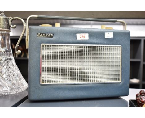 A vintage Hacker Sovereign transistor radio in blue colour having carry handle, L31cm