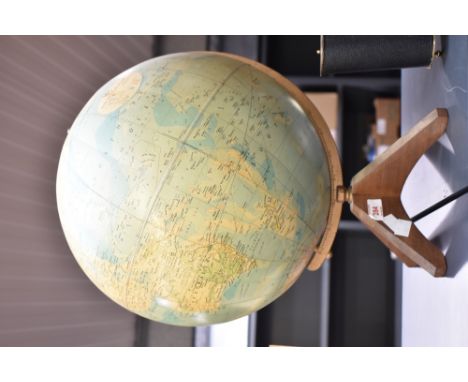 A World Master Globe supported on teakwood legs, h44cm