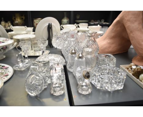 A group of Waterford crystal and other glass ware, to include timepiece, candlesticks, salt and pepper shaker ect