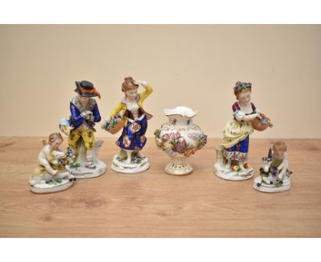 A 19th century Dresden porcelain urn, decorated with gilt edging and romantic lovers within a stylised motif border on a whit