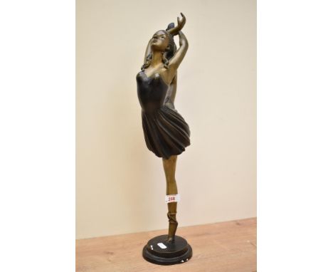 An attractive Art Deco style patinated metal figure of a female dancer, h49cm