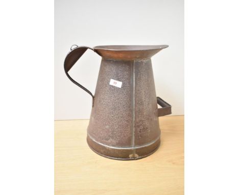 A vintage two gallon milk pale of traditional form with patina