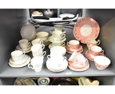 A Melba Bone China part tea service, decorated with floral patterns on a white ground, (17), sold together with another Melba