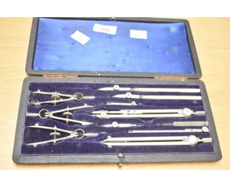 An early 20th century Cartographer's / drawing instrument set, having 11 pieces within a rich blue velvet interior, w25cm.  C