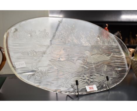 An attractive moulded glass oval platter, decorated with duck pond scene 42.5cm sold along with a decorative duck form 'hen o