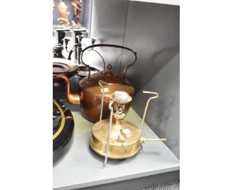 An early 20th century brass camp stove with copper kettle, (2)