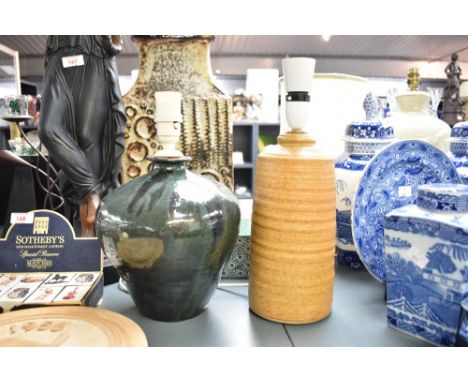 A stoneware table lamp having textured patterns on a sand coloured ground, h26cm, sold together with a green glazed table lam