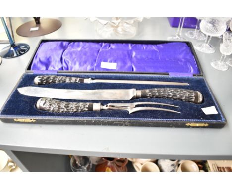 A John Sanderson of Sheffield cased 3 piece carving set comprising of fork, carving knife and carving steel, L41.5cm