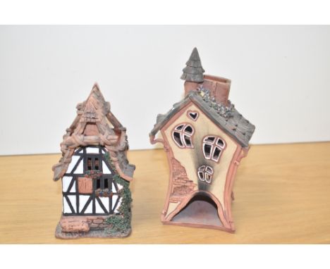 A ceramic house / light candle holder, signed to base, h21cm, sold together with another ceramic house, ( 2 )