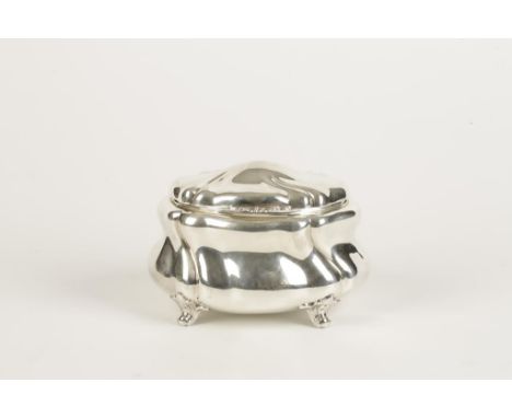 A GERMAN SUGAR BOX/TEA CADDY of shaped oval form, with hinged cover, the whole on scrolling feet, the base stamped with a Ger