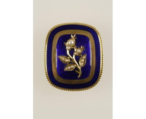 A BLUE ENAMEL AND YELLOW METAL BROOCH decorated with a bouquet of flowers inlaid with seed pearls, with vacant locket back