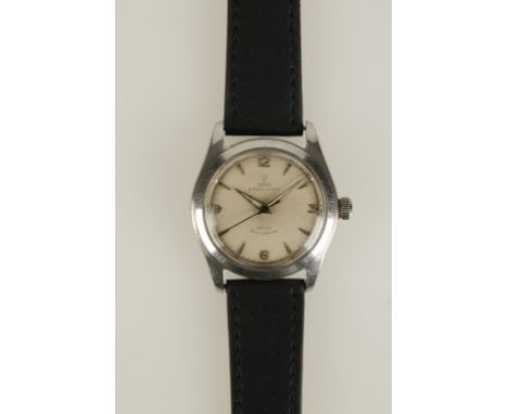 TUDOR: A GENTLEMANS WHITE METAL WRISTWATCH, the round dial with Arabic and baton numerals, sweep seconds hand, inscribed "Tud