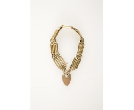 A 9CT YELLOW GOLD GATE-LINK BRACELET with a heart-shaped clip fastener (c.19grams).