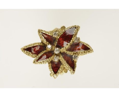 A GUILLOCHE ENAMEL AND DIAMOND CHUNKY DRESS RING with seven red guilloche enamel leaves set in yellow metal, interspersed wit