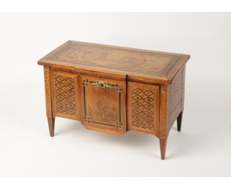 AN ITALIAN MINIATURE MARQUETRY COMMODE, in the manner of Magginini, with a rectangular breakfront top with a central marquetr