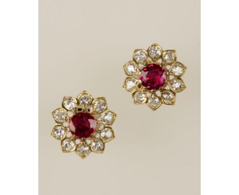 A PAIR OF RUBY AND DIAMOND EARRINGS, the rubies surrounded by a border of old-cut diamonds c.1.20cts (total), on unmarked yel