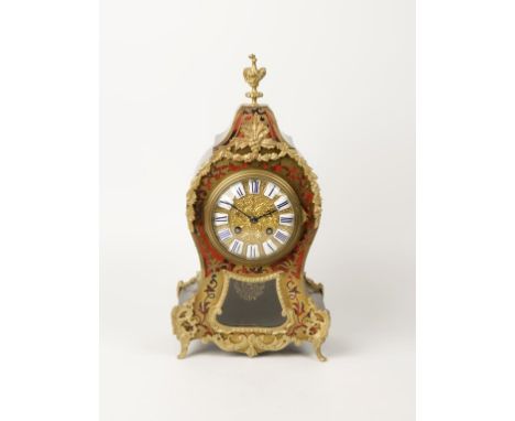 A FRENCH BOULEWORK AND EBONY MANTEL CLOCK, the gilt dial with raised Roman numerals, the eight day movement striking on a bel