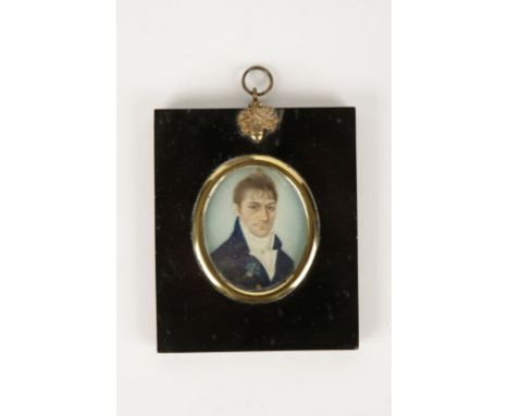 ENGLISH SCHOOL, 19th century A portrait miniature of a gentleman wearing a blue coat and white cravat, in an ebonised frame w
