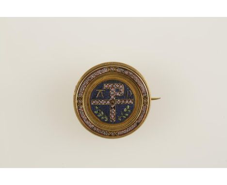 A MICRO-MOSAIC AND YELLOW METAL BROOCH decorated with "pax" symbol, in the manner of Castellani