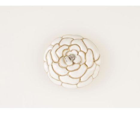 A CARTIER WHITE ENAMEL AND DIAMOND FLOWER BROOCH in the form of a chrysanthemum with petals radiating from a central baguette