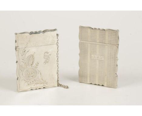 AN AMERICAN CARD CASE of shaped rectangular form, engraved with a floral sprig and initialled, marked Sterling, with attachme