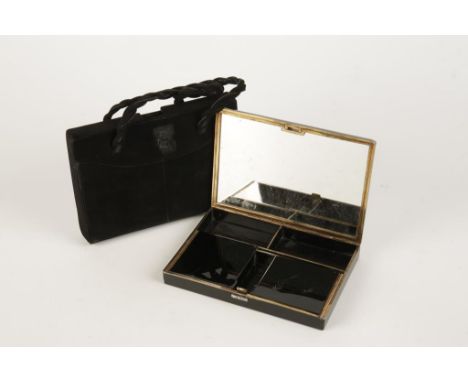 CARTIER: A simulated black onyx evening bag, with a rectangular button clasp set with old-cut diamonds, the fitted interior w