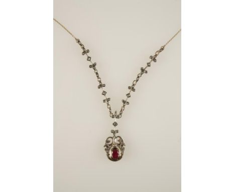 A 19TH CENTURY OLD-CUT DIAMOND PENDANT NECKLACE, the open scrollwork pendant c.42mm long, with a later oval-cut ruby set in u