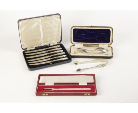 A QUANTITY OF CASED SETS comprising a cased pickle fork, Sheffield 1971, a set of six tea knives with silver handles, a cased