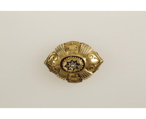 A VICTORIAN YELLOW METAL MOURNING BROOCH decorated with blue enamel and a single seed pearl, with a vacant locket back