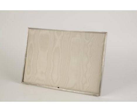 ASPREY & CO: A PHOTOGRAPH FRAME of rectangular panoramic form with engine-turned decoration, leather back and strut, London 1