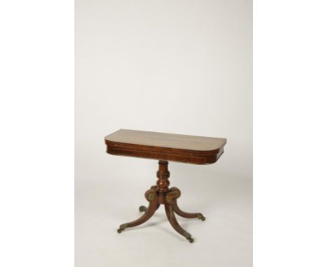 A REGENCY ROSEWOOD AND SATINWOOD STRUNG CARD TABLE, the rectangular top with rounded corners enclosing a baize-lined playing 